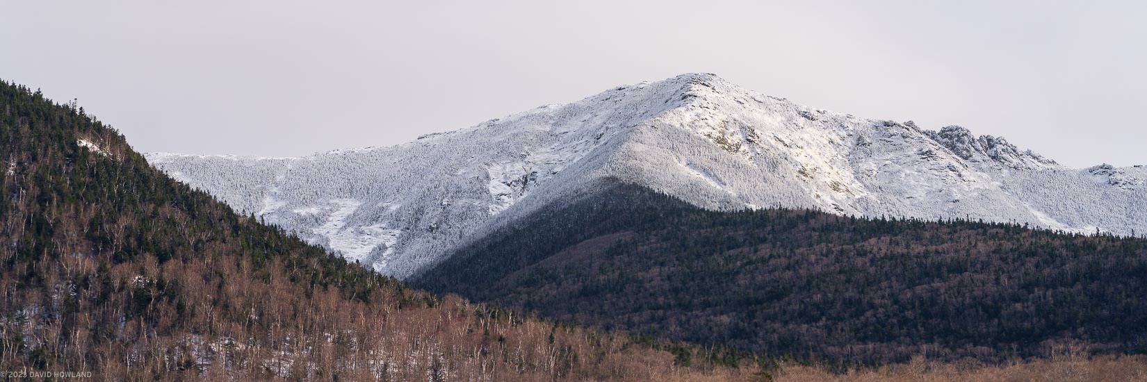A panorama photo of snow and ice covering Mount Lincoln in the White Mountains of New Hampshire.