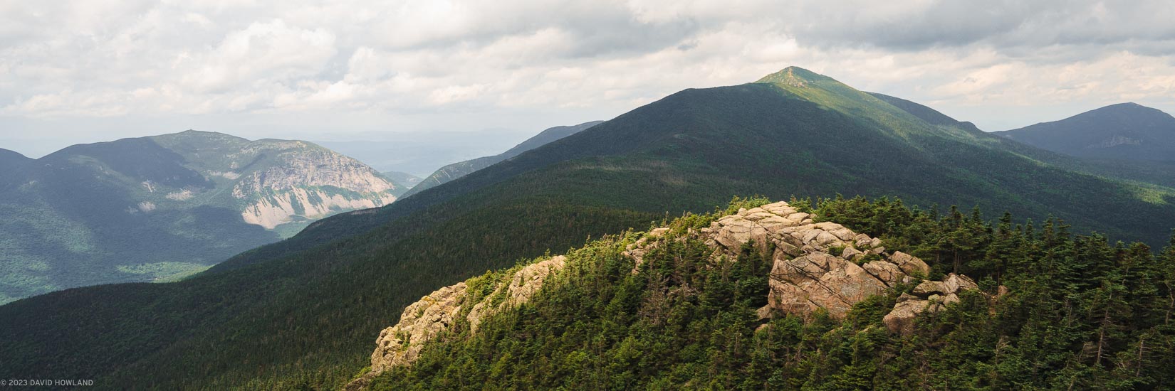 A panorama photo of the summits of Mount Lincoln, Cannon Mountain, and Little Haystack in Franconia Notch in the White Mountains of New Hampshire