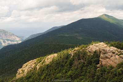 A panorama photo of the summits of Mount Lincoln, Cannon Mountain, and Little Haystack in Franconia Notch in the White Mountains of New Hampshire